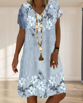 V-ringad avslappnad klänning i blommönster med kort ärm